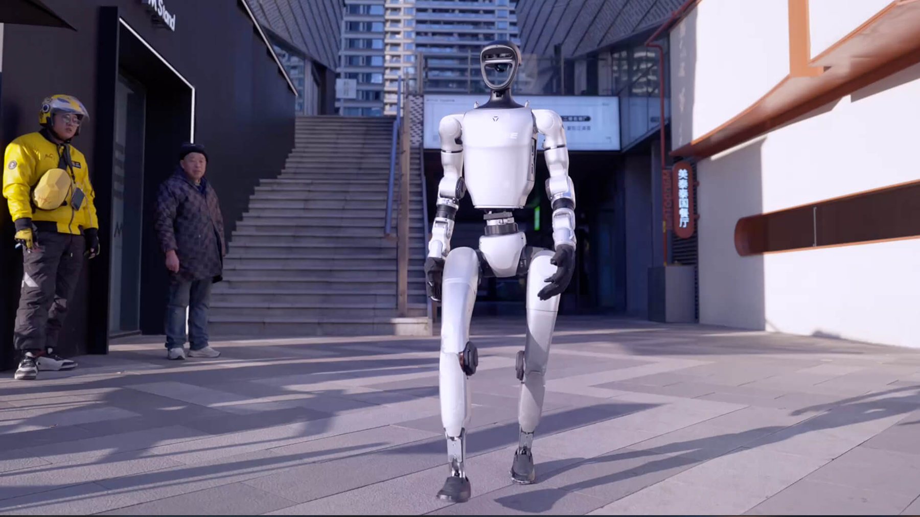 Full-body Unitree G1 humanoid robot walking outdoors